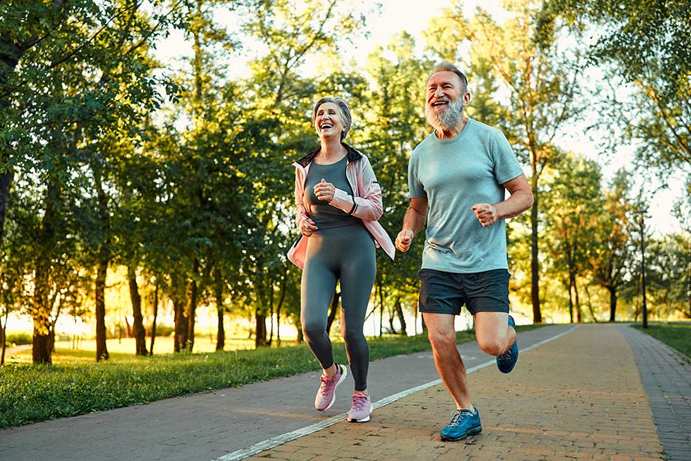 couple running through the park